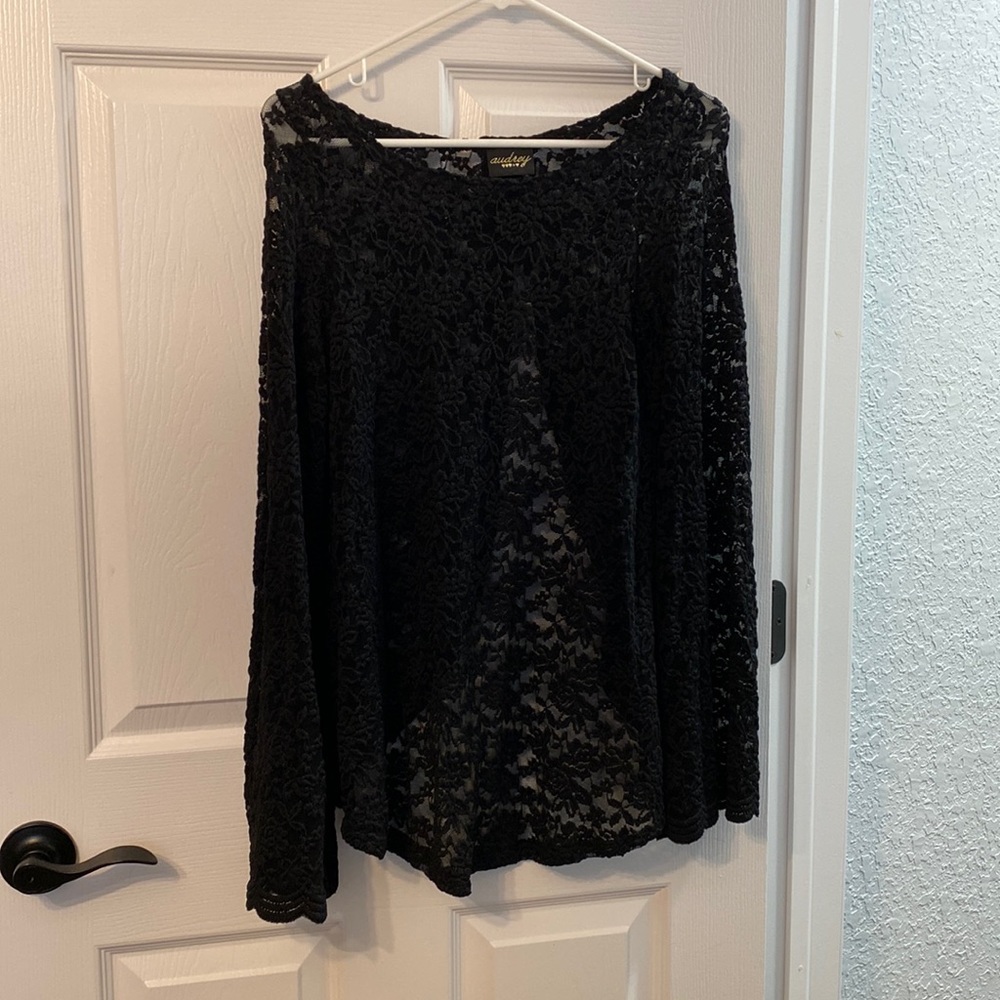 Black lace top with bell sleeves and open split back